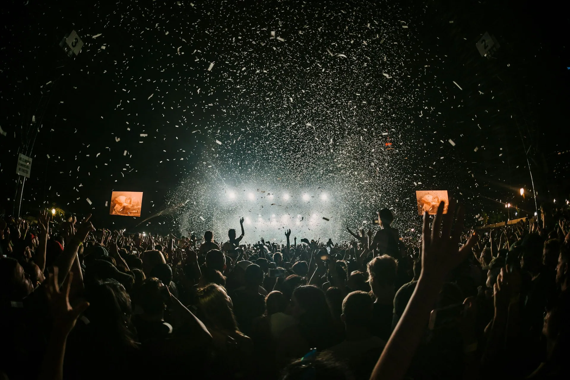 Confetti falling over a crowd at a large brand activation event
