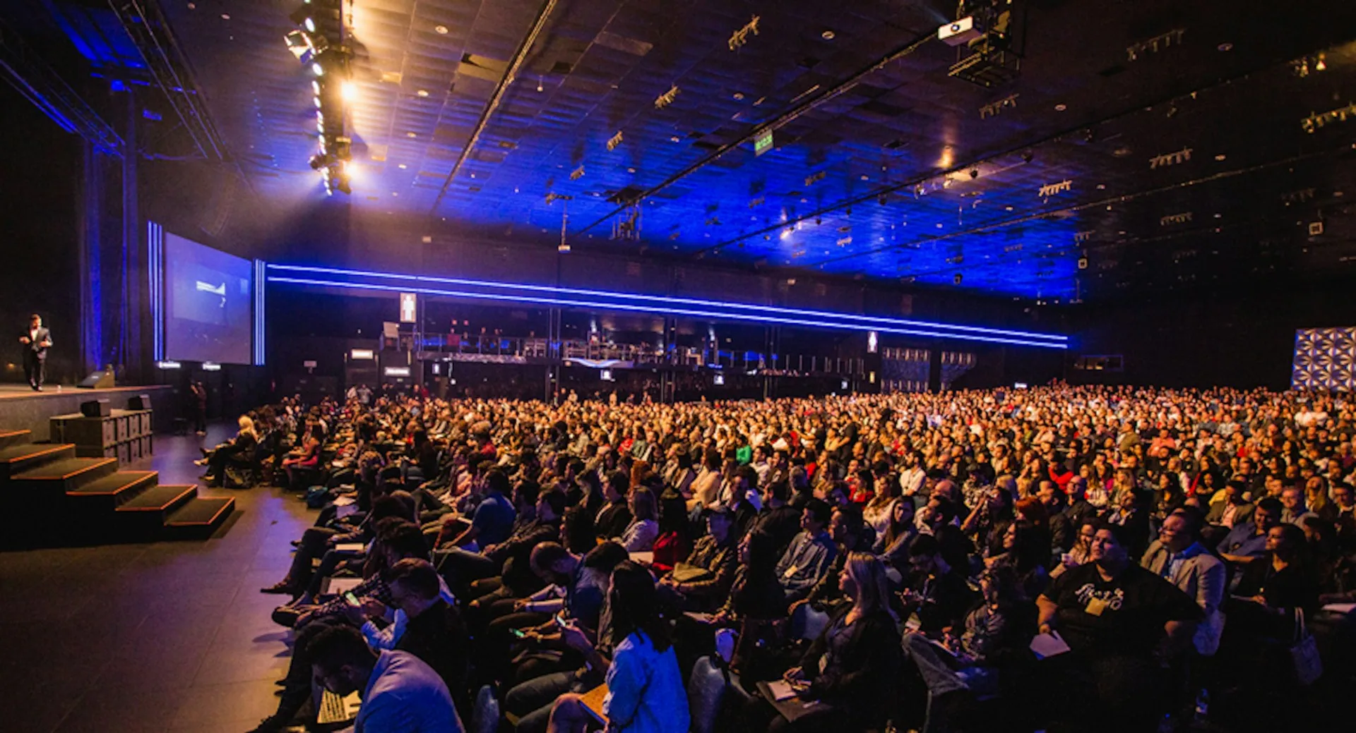 A full auditorium during a large industry conference