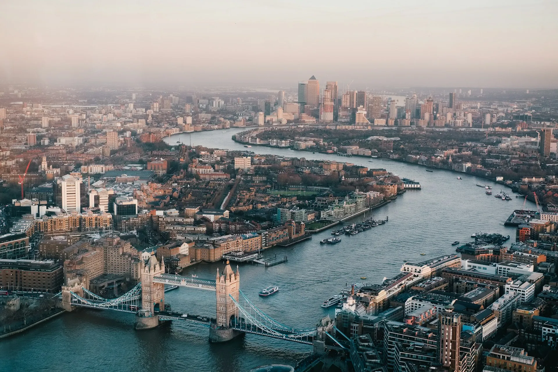 An aerial view of London along the Thames at dusk